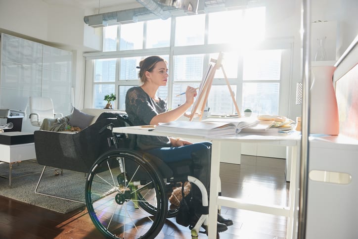 Law Office of Tipton-Downie | Attorney at Law | Vidalia, GA | Caucasian woman in wheelchair painting on easel