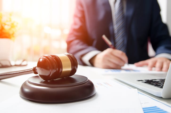 Law Office of Tipton-Downie | Attorney at Law | Vidalia, GA | Wooden gavel on table. Attorney working in courtroom.